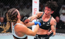 Жесткой зарубой обернулся бой за титул в UFC